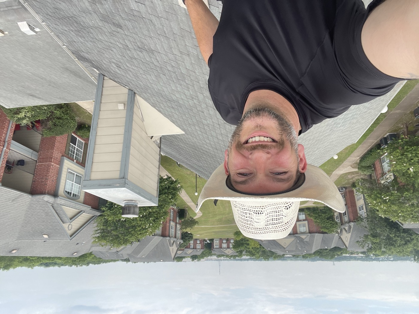 John Baudry, owner of BE Construction, on a roof during an inspection