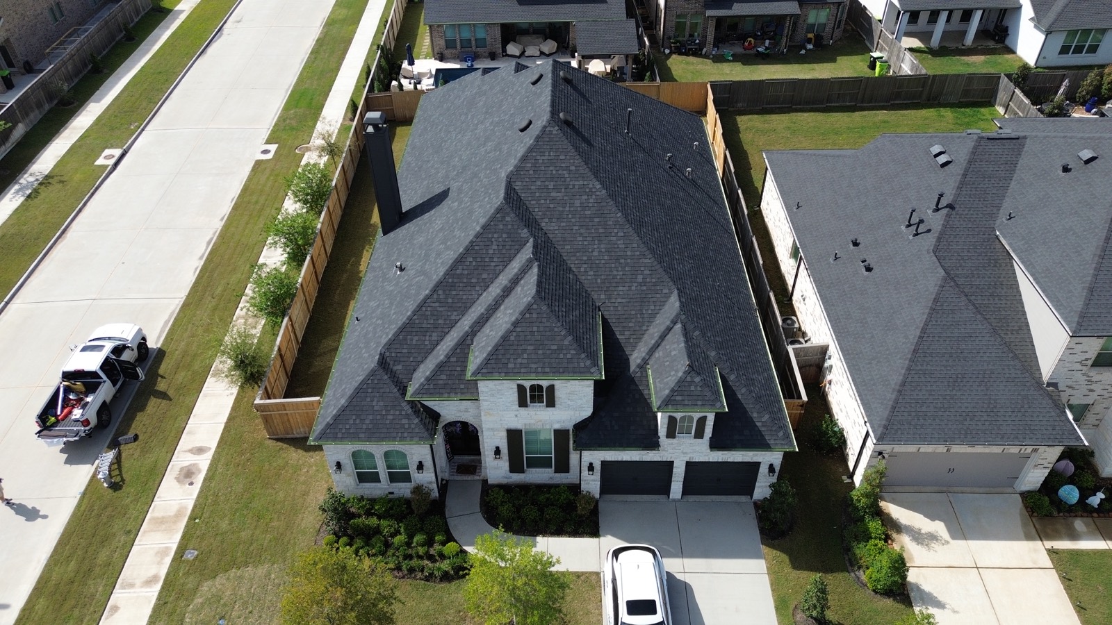 Completed roof replacements across a suburban neighborhood